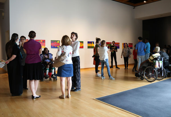 A Wave of Change artists, teachers, and parents during the exhibition reception. Photo: Leslie Elsasser
