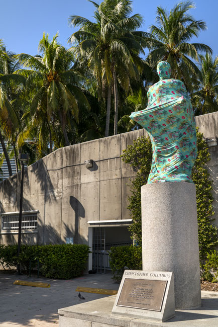 Joiri Minaya, The Cloaking of the statue of Christopher Columbus behind the Bayfront Park Amphitheatre, Miami, Florida, 2019. dye-sublimation print on spandex fabric and wood scructure. Photos by Zachary Balber, commissioned by Fringe Projects Miami. Courtesy of the artist.