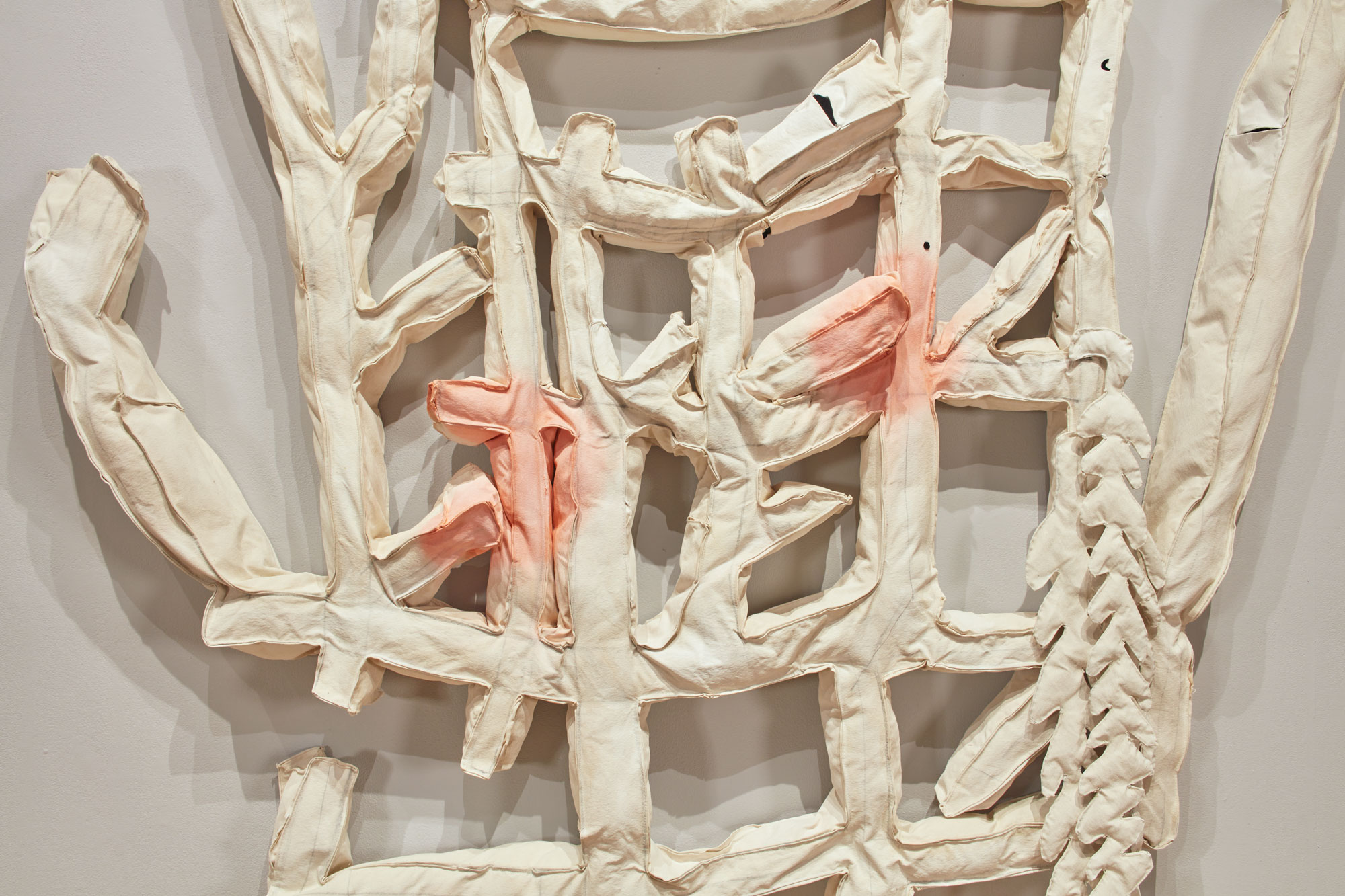 Cynthia Mason, Limp Aristocratic Grid with Arms (detail), 2020. shredded documents, polyester fiber, velvet, charcoal, soft pastel, gesso, grommets, thread, canvas. 92 x 82 x 18 in. Courtesy of the artist. Installation view of Skyway 20/21 exhibition at USF Contemporary Art Museum. Photo: Will Lytch.