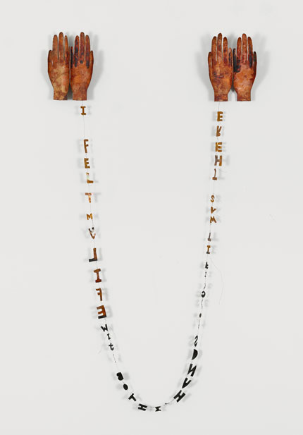 Lesley Dill, Copper Poem Hands, 1994. Patinaed copper wall sculpture with wire. 57h x 31w x 2d inches (installed). Edition: 50